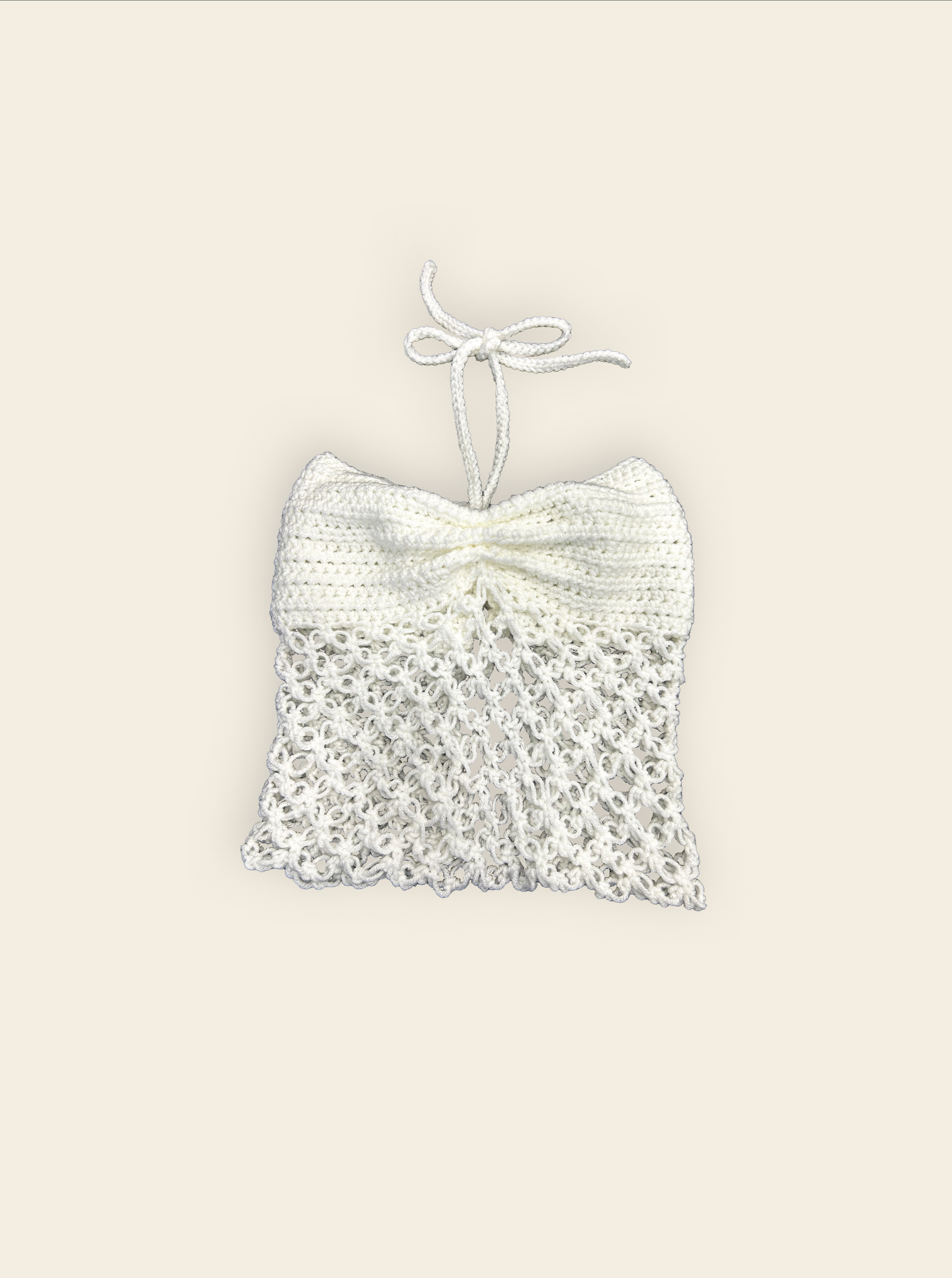 White top on a beige background